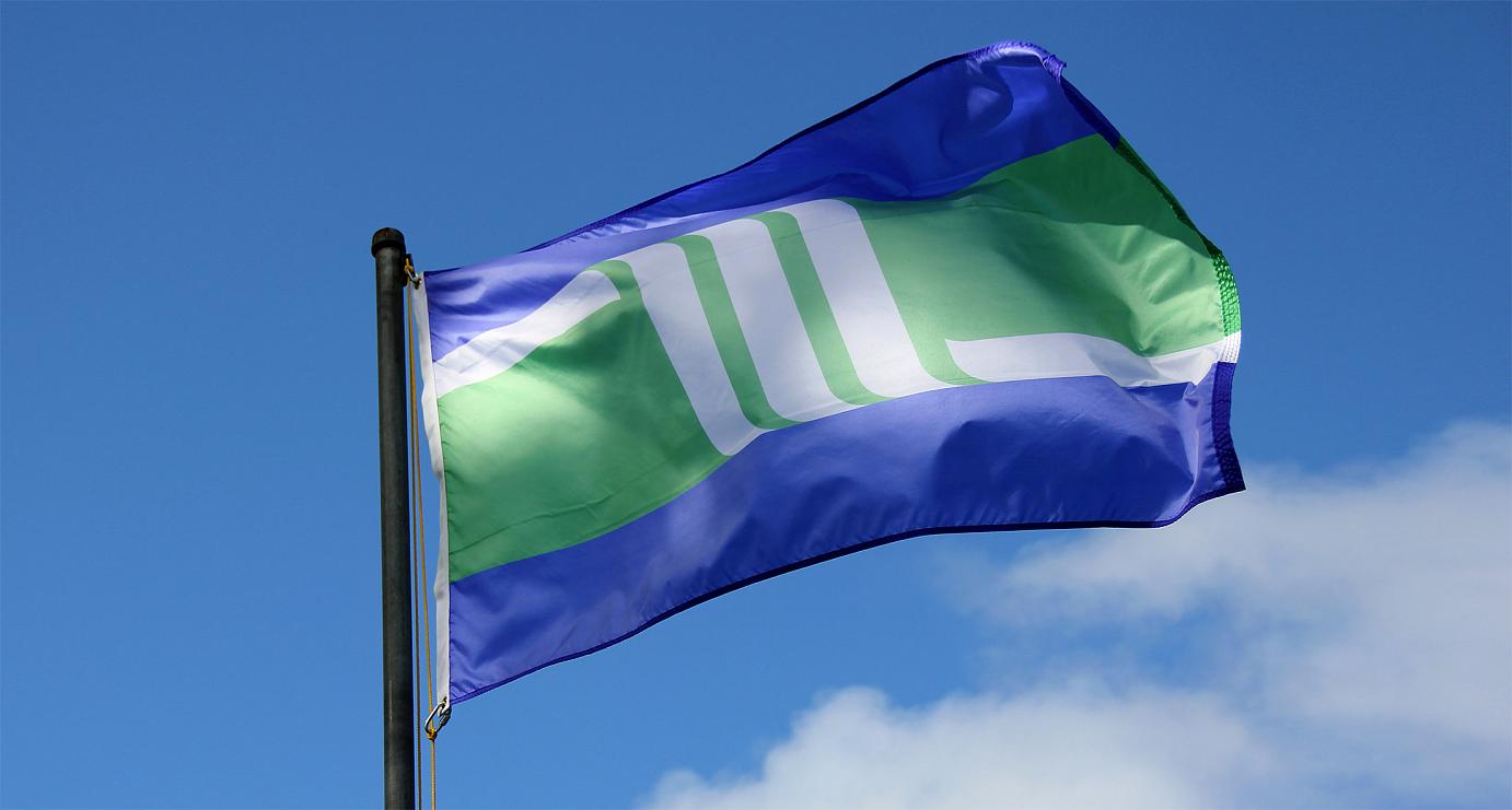 Amoskeag Flag flying on a flagpole